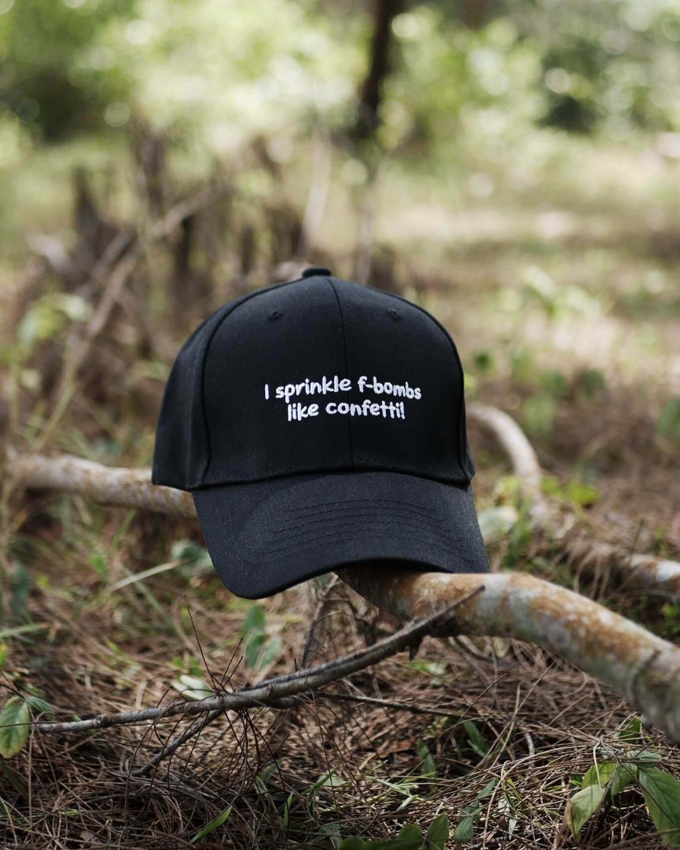 Black cap with text on a branch